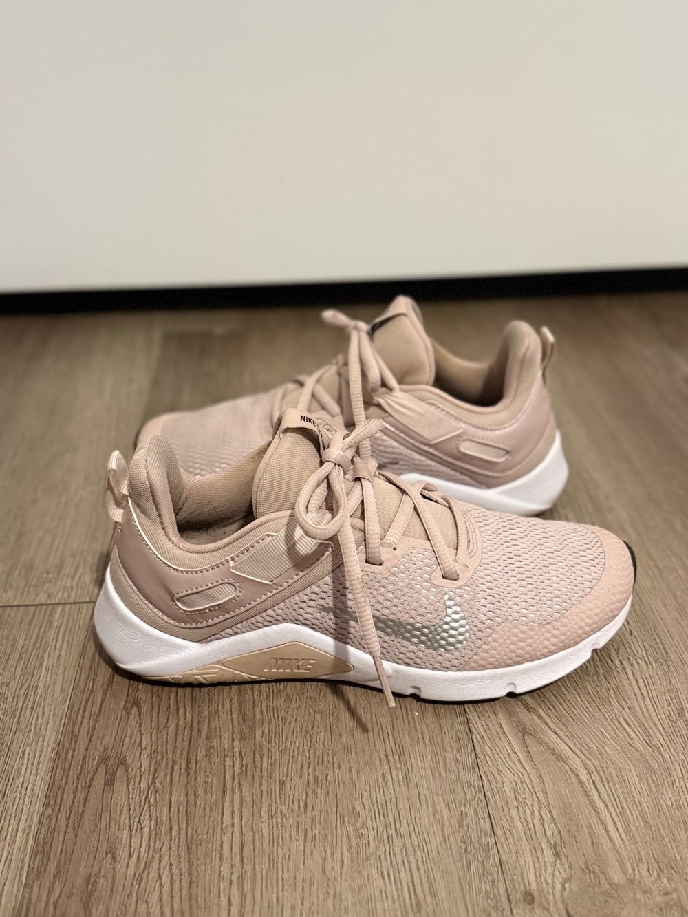 Nike Women’s Blush Pink Athletic Sneakers with Silver Swoosh
